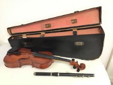 A violin and bow with vintage travelling case (a/f) (violin: 61cm x 21cm) and a wind instrument (