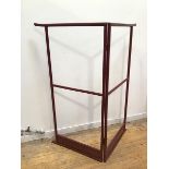 A Japanese red lacquer kimono stand, the top rails with flared ends, with central hanging rail and