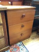A modern small teak chest of drawers fitted three drawers, on plinth base (73cm x 55cm x 42cm)