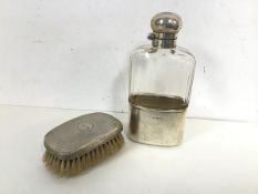 An Edwardian hip flask with a 1920s London silver cup and lid having a faceted glass body (16cm x