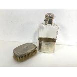 An Edwardian hip flask with a 1920s London silver cup and lid having a faceted glass body (16cm x