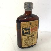 A bottle of White Horse Celler whisky, bottled 1954 no.103386, flask sized (19cm x 10cm x 4cm)