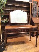 A mahogany Whytock & Reid dressing table with hinged mirror, the top with moulded edge above a