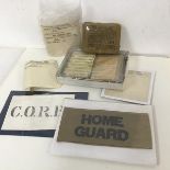 WWII interest: A Home Guard armband (9cm x 20cm), War Economy labels, a First Field Dressing kit,