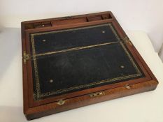 A 19thc mahogany travelling writing slope with fitted interior and tooled leather writing surface (