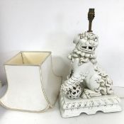 A large Chinese white Dog of Fou table lamp complete with shade (52cm to top of lamp holder x 32cm x