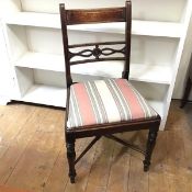 A 1920s Regency style side chair with drop in upholstered seat on turned supports with X