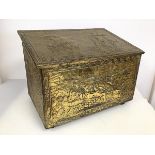 A 1950's coal box, the exterior with relief decorated brass depicting maritime scenes, with wooden