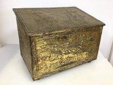 A 1950's coal box, the exterior with relief decorated brass depicting maritime scenes, with wooden