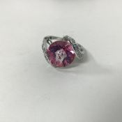 A 14ct white gold and pink topaz dress ring with diamond set shoulders (topaz round faceted pink: