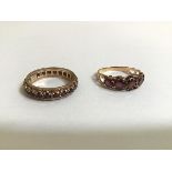 A 9ct gold garnet full hoop eternity ring, stamped marks, together with a five stone garnet ring,