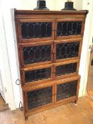 An Edwardian mahogany bookcase, the four tiers with two leaded glazed doors, on mallet feet (143cm x