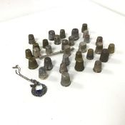 A collection of thimbles, including silver, brass and white metal, an Edwardian mechanical pencil