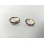 An 18ct gold ring set five graduated diamonds within a pierced setting (O) and another gold ring set