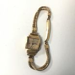 A 1940s/50s Ancre lady's wristwatch, reverse marked 18ct, on gold plate strap (9cm) (15.90g)