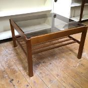 A teak coffee table with smoked glass top above a lower slatted tier, on straight supports (39cm x