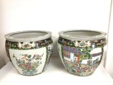 A pair of Chinese goldfish bowls with alternating floral panels and panels depicting Female