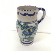 A 1930s Honiton glazed stoneware jug (slight hairline crack to rim), with foliate decoration and