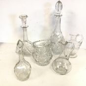 A collection of glass and crystal including three decanters with stoppers and two jugs, various