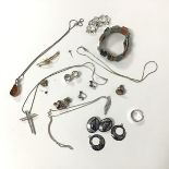 A collection of silver and costume jewellery including niello ware, clip on earrings and hoop