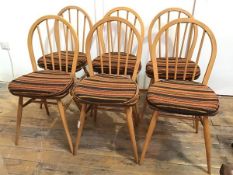 A set of six beech and elm Ercol 400 style Windsor kitchen chairs, with hooped spindle backs above