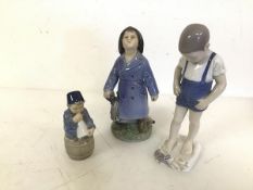 A Danish B & J figure of a Boy in Tidal Pool (repairs) (20cm) and two other Royal Copenhagen figures