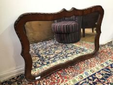 An Edwardian wall mirror, with a moulded mahogany cartouche style frame (67cm x 103cm)