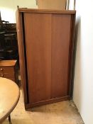 A mid century teak wardrobe, Austinsuite, with two sliding doors, with half shelved interior, half