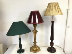 A mixed lot of lamps including a green painted wooden lamp, a baluster shaped gilt lamp with