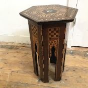 A Middle Eastern occasional table with hexagonal top with inlay, on inlaid pierced base (48cm x