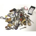 An assortment of silver and costume jewellery including pendants, badges, cameos, rings (a lot)