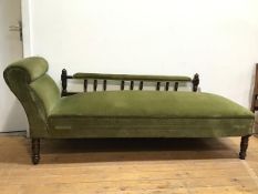 A late Victorian chaise longue in olive green upholstery, hinged to allow opening to larger bed size