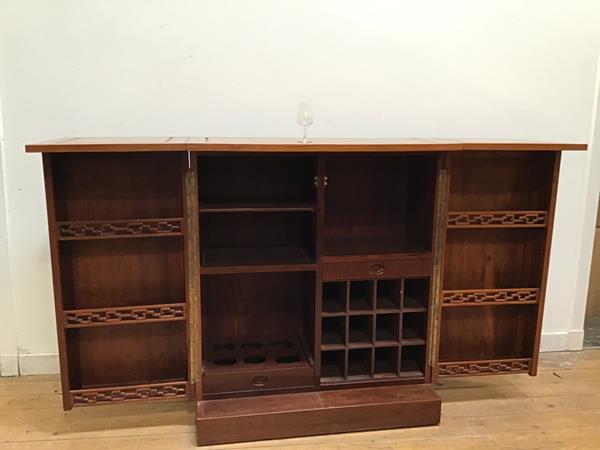 A Chinese hardwood bar, the rectangular cabinet with two front fold out doors with carved dragon