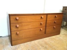 A Stag teak low chest of drawers with rounded edges, fitted three long drawers and three short