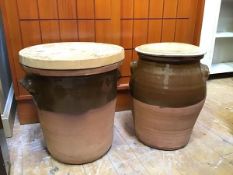 Two partially glazed teracotta pots, both with glazed interiors and having wooden seats to top, some