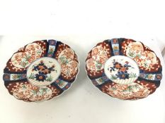 A pair of 1930s/40s Imari chargers with scalloped edges (5cm x 31cm)