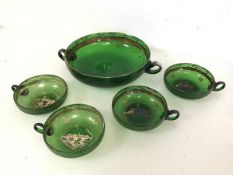 A green glass two handled punch bowl, c1900 (6cm x 28cm x 21cm), together with four squat matching