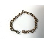 A yellow metal and metal link chain bracelet, possibly made up of associated chains (11cm) (21.91g)