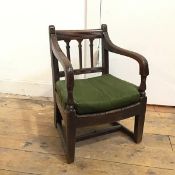 A 19thc Regency style child's open armchair, possibly adapted from high chair, with green seat