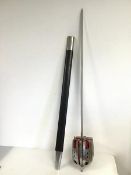 A reproduction broad sword with basket hilt and leather scabbard (combined length 103cm)