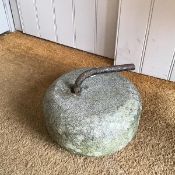 A vintage curling stone (19cm x 25cm)