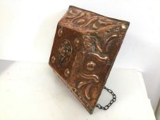 An Edwardian copper lid with naturalistic repousse decoration, adapted to hang as light shade (