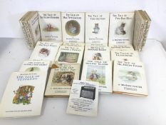 A large collection of Beatrix Potter children's books including The Tale of Tom Kitten, Two Bad