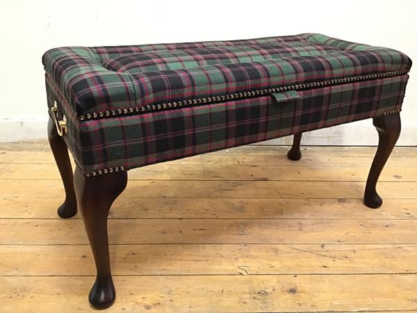 A modern Georgian style footstool with hinged tartan wool upholstered top, with brass handles to