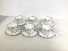 A set of six Flosmaron teacups, of conical form, complete with matching saucers, all with tree