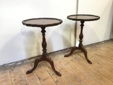 A pair of reproduction mahogany wine tables, in the Georgian style, both with piecrust scalloped