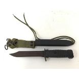 A Vietnam period jungle knife with US style hard plastic ribbed handle and scabbard (model 78B),