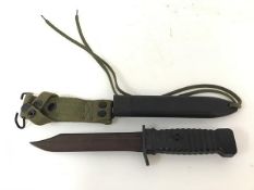 A Vietnam period jungle knife with US style hard plastic ribbed handle and scabbard (model 78B),