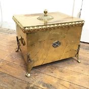 An Edwardian brass coal scuttle, the removable top with beaded edge, with drop handles to sides on