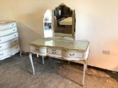 A Louis XV style dressing table with bevelled glass triptych mirror above an arrangement of drawers,